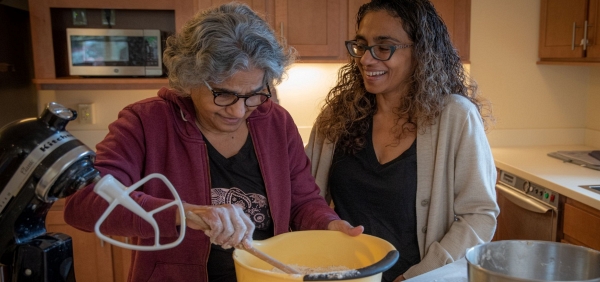 senior woman and daughter baking